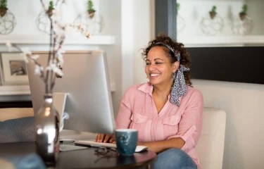Happy woman working from her home office