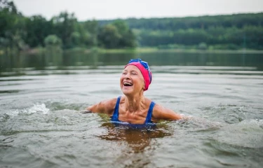 Mature woman swimming in lake