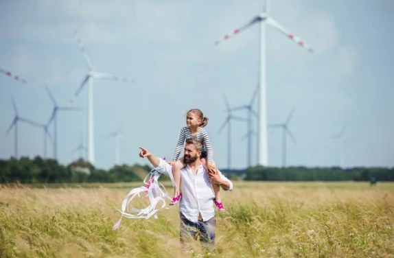 Father and daughter at windfarm 