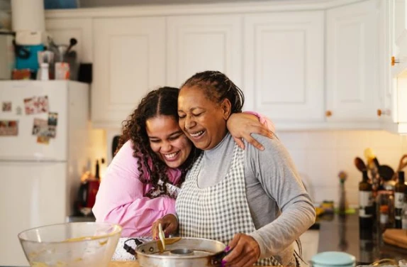 Mother and daughter cooking